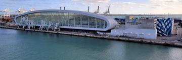 Norwegian Cruise Line Terminal B at PortMiami, a modern cruise terminal building on the waterfront.